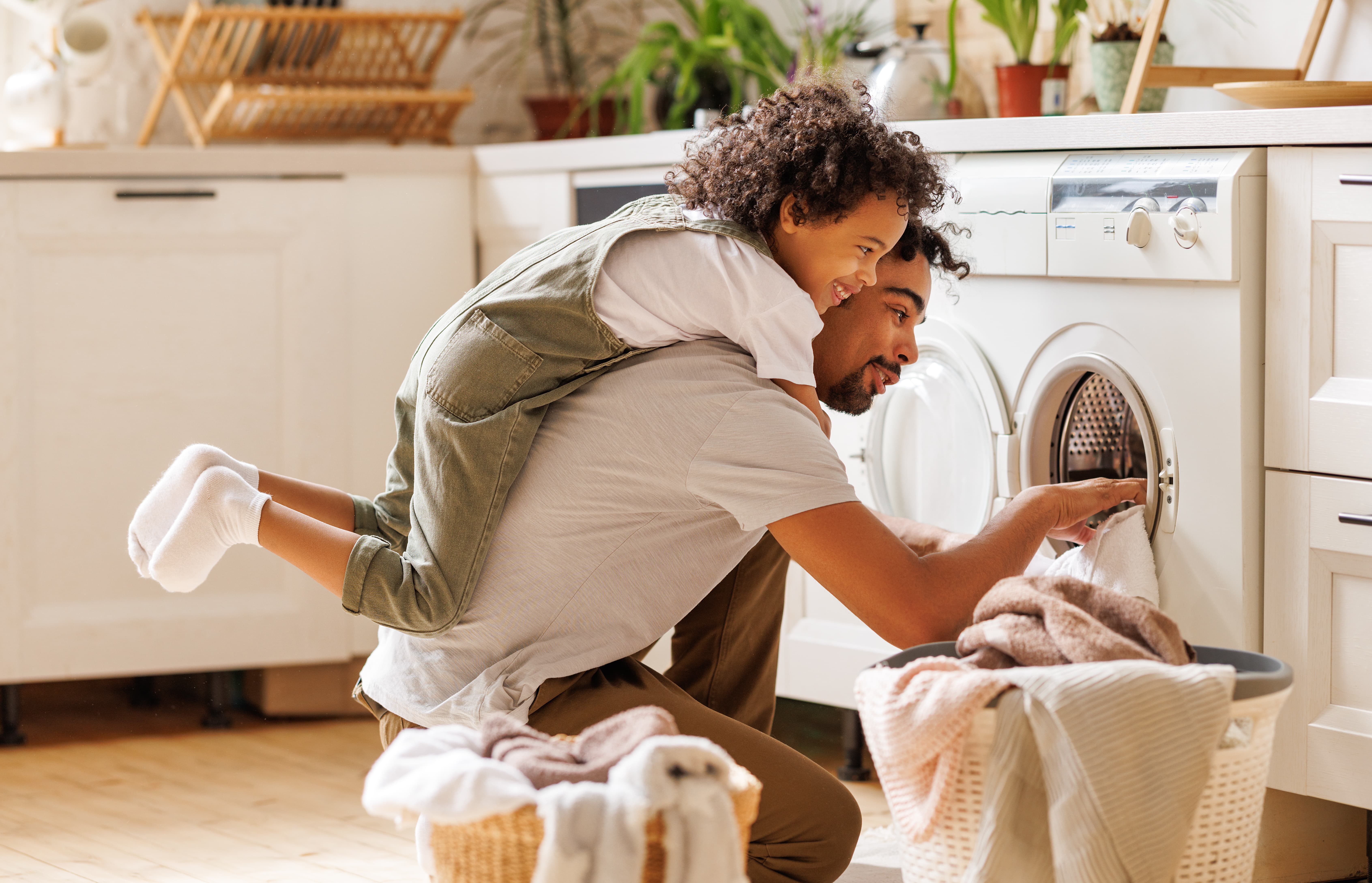 The Real Cost of Doing Laundry at the Wrong Time (Summer Peak Hours Edition)_Father and Son Doing Laundry
